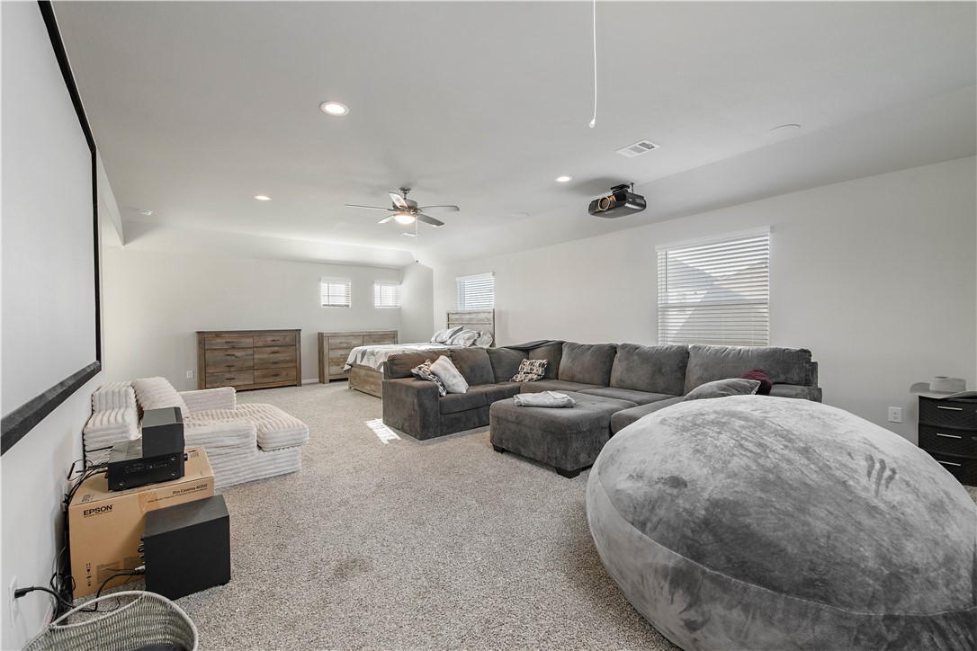 4705 Milagro Loop Bryan, TX 77807 - Photo 13 of 28 a living room with couches and kitchen view