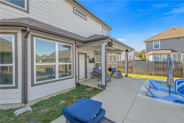 a bathroom with a double vanity sink toilet and shower