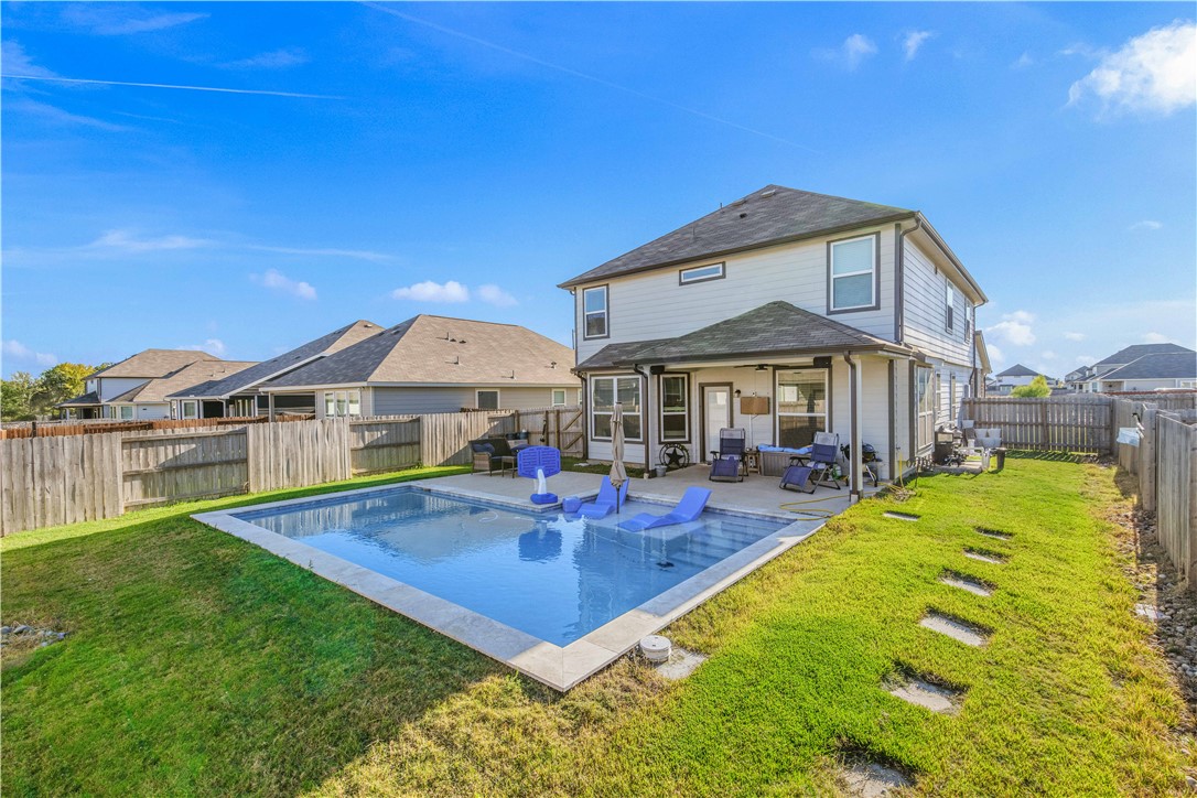 4705 Milagro Loop Bryan, TX 77807 - Photo 26 of 28 a front view of house with yard and outdoor seating