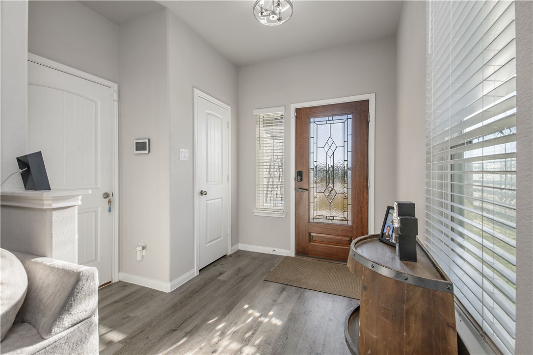 4705 Milagro Loop Bryan, TX 77807 - Photo 4 of 28 a living room with furniture and large windows