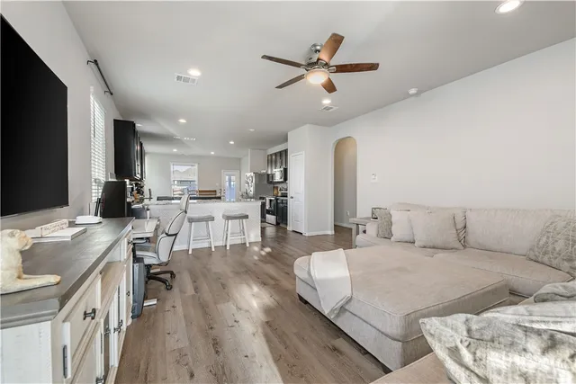 a living room with furniture and a large window