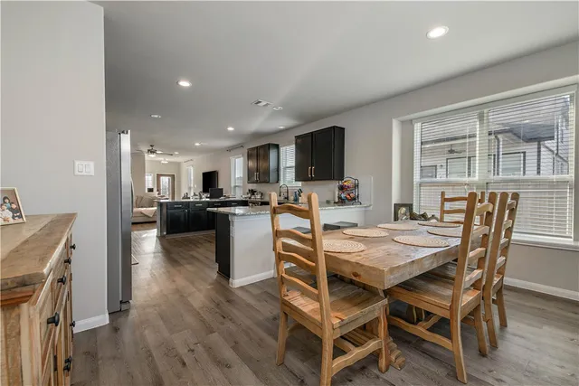 a view of a dining room with furniture and a livingroom