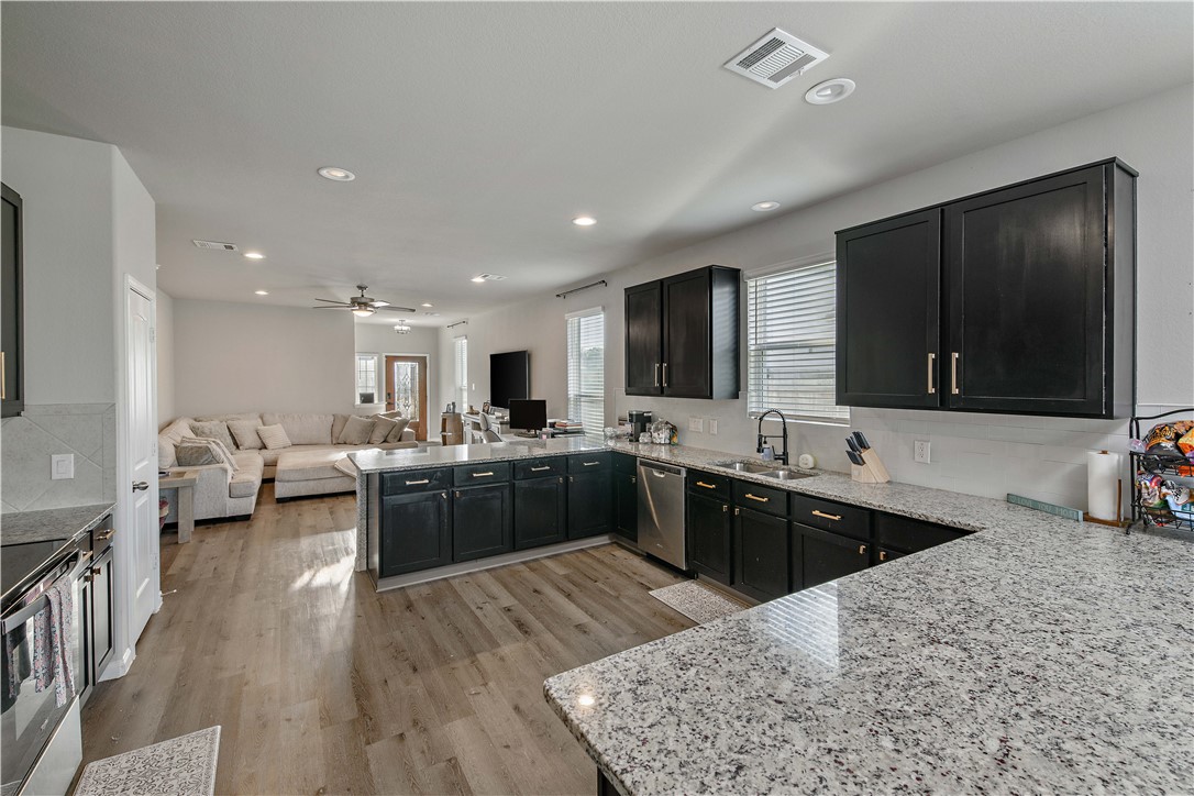 4705 Milagro Loop Bryan, TX 77807 - Photo 28 of 28 a large kitchen with lots of counter space a sink and appliances
