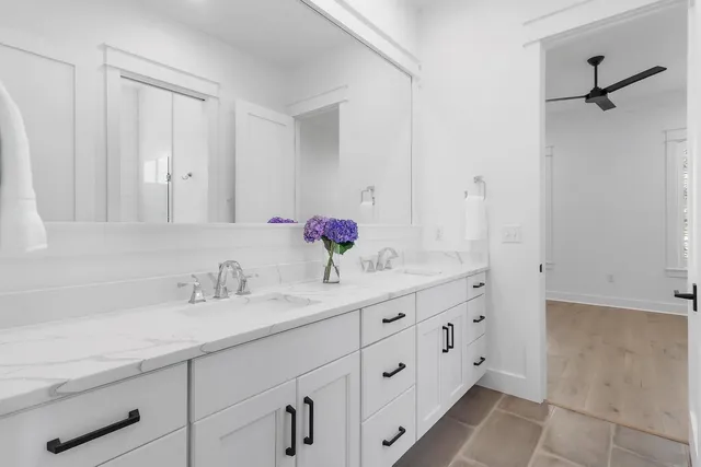an aerial view of a house with a yard basket ball court and outdoor seating