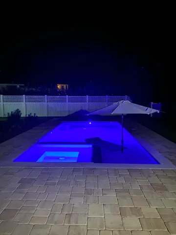 a view of a swimming pool with a patio