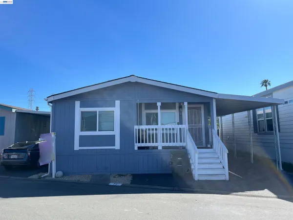 a backyard of a house with seating space