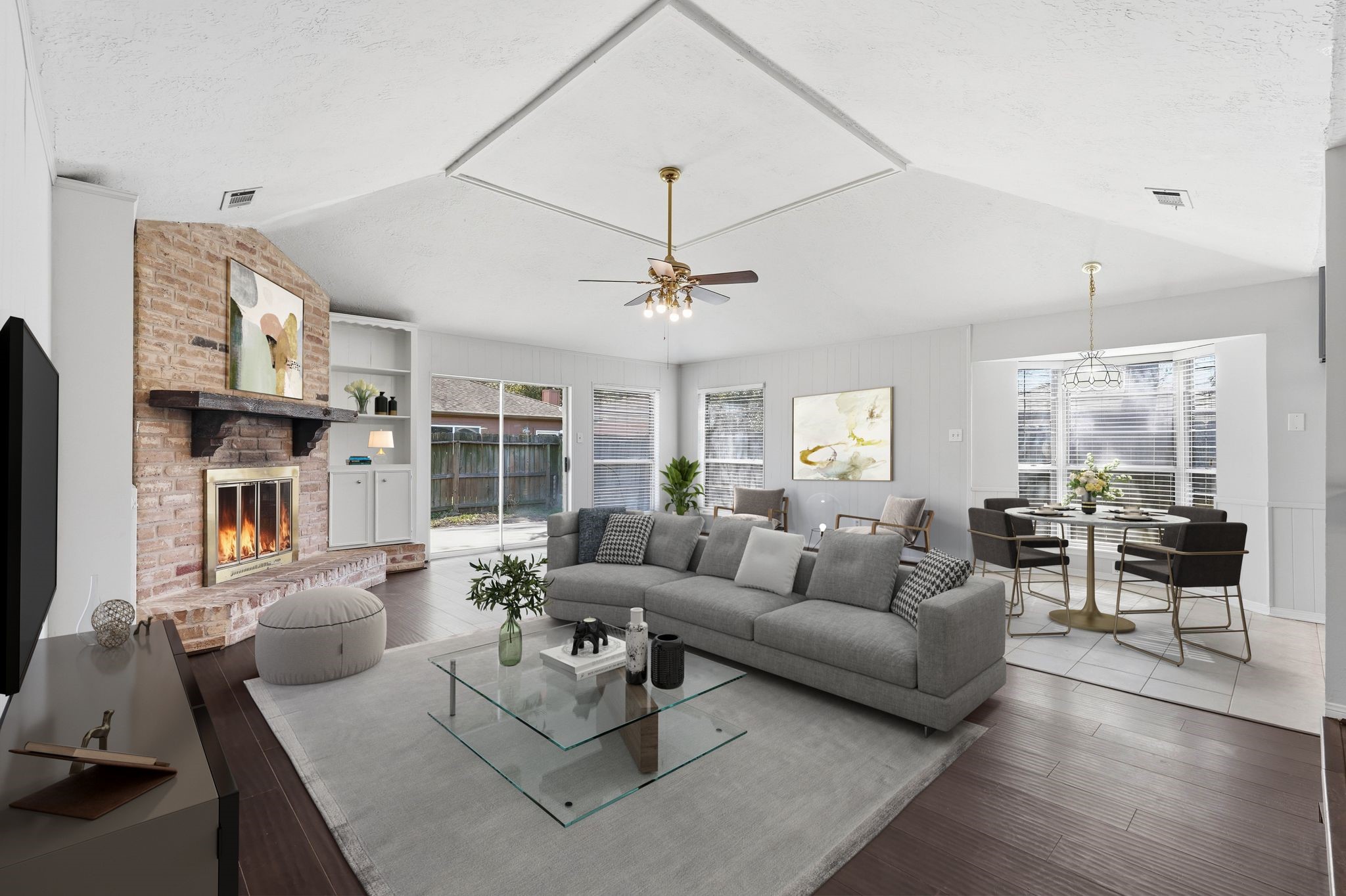 6807 Falling Waters Drive Spring, TX 77379 - Photo 1 of 22 a living room with furniture fireplace and a large window