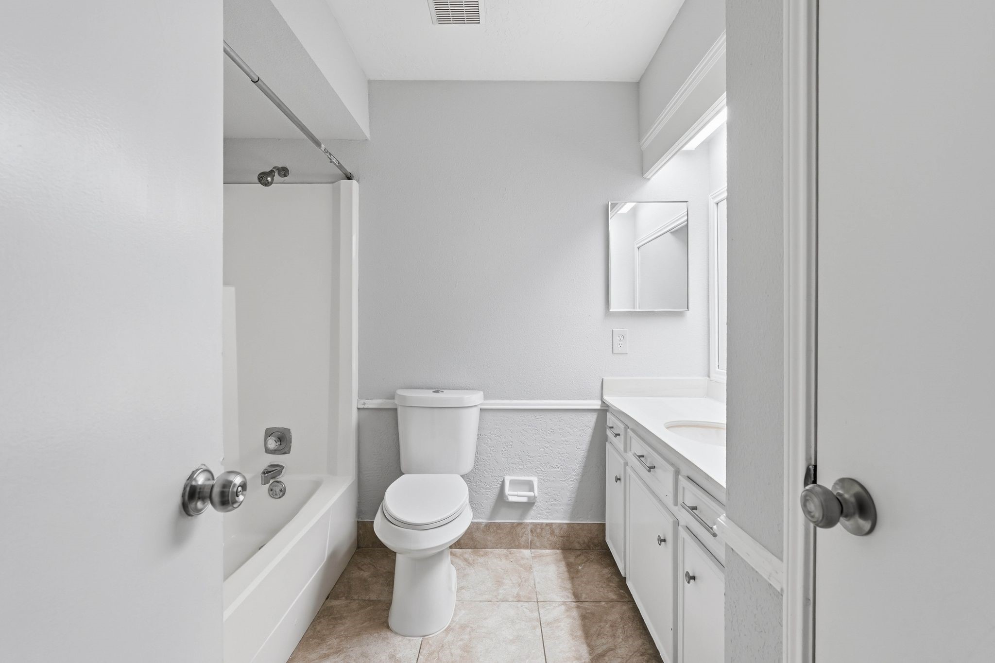 6807 Falling Waters Drive Spring, TX 77379 - Photo 16 of 22 a bathroom with a sink a toilet and shower