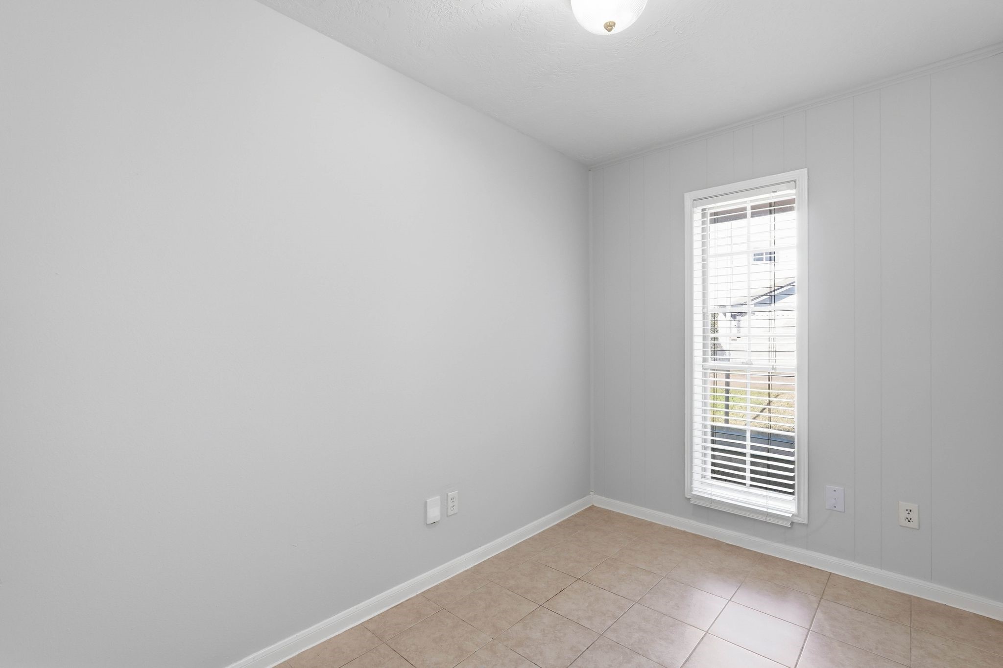 6807 Falling Waters Drive Spring, TX 77379 - Photo 18 of 22 a view of an empty room with a window