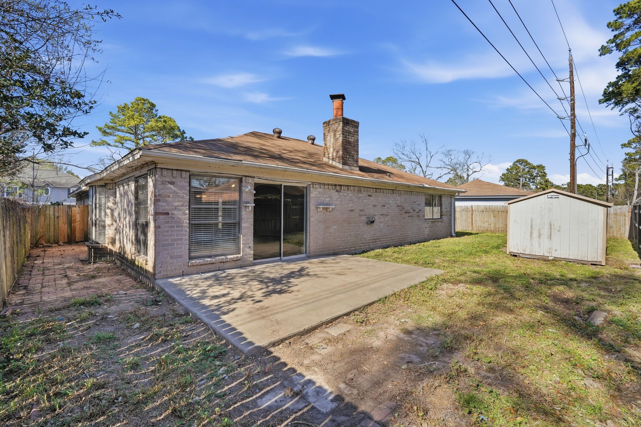 6807 Falling Waters Drive Spring, TX 77379 - Photo 20 of 22 a front view of a house with a garden