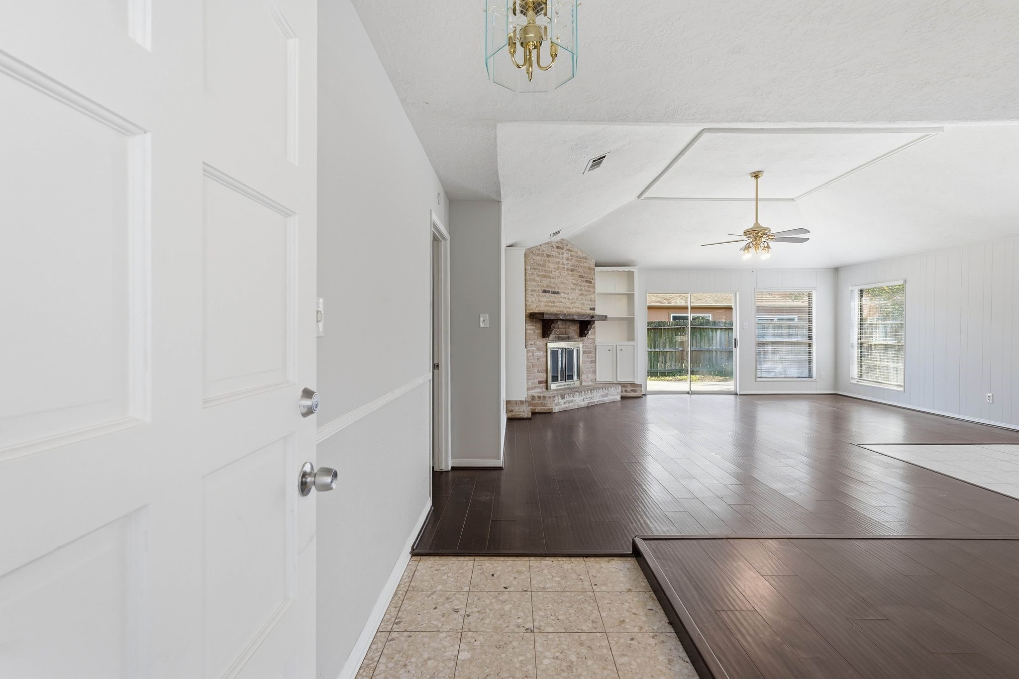 6807 Falling Waters Drive Spring, TX 77379 - Photo 4 of 22 wooden floor in an empty room with a window