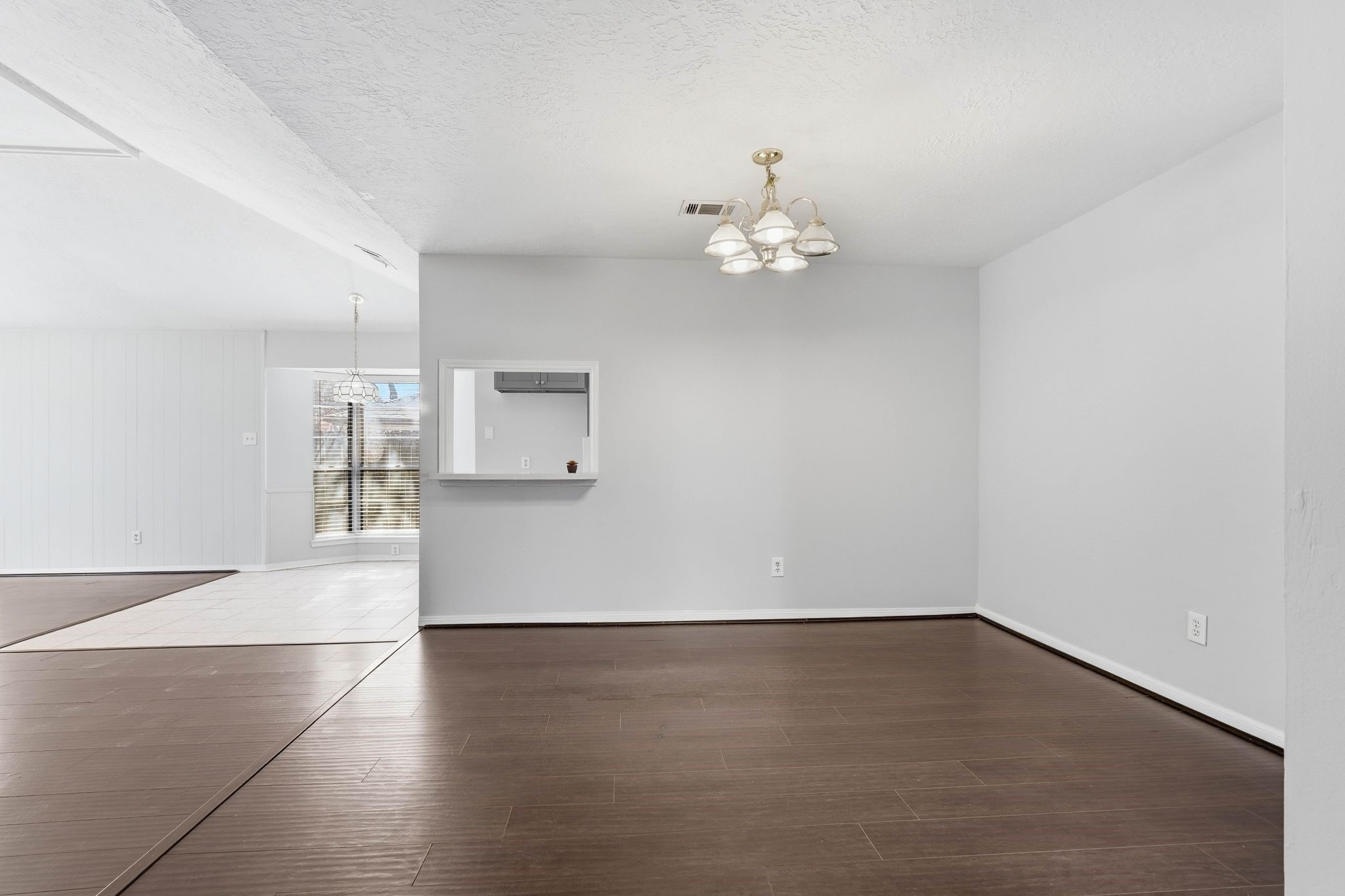 6807 Falling Waters Drive Spring, TX 77379 - Photo 9 of 22 an empty room with wooden floor and windows