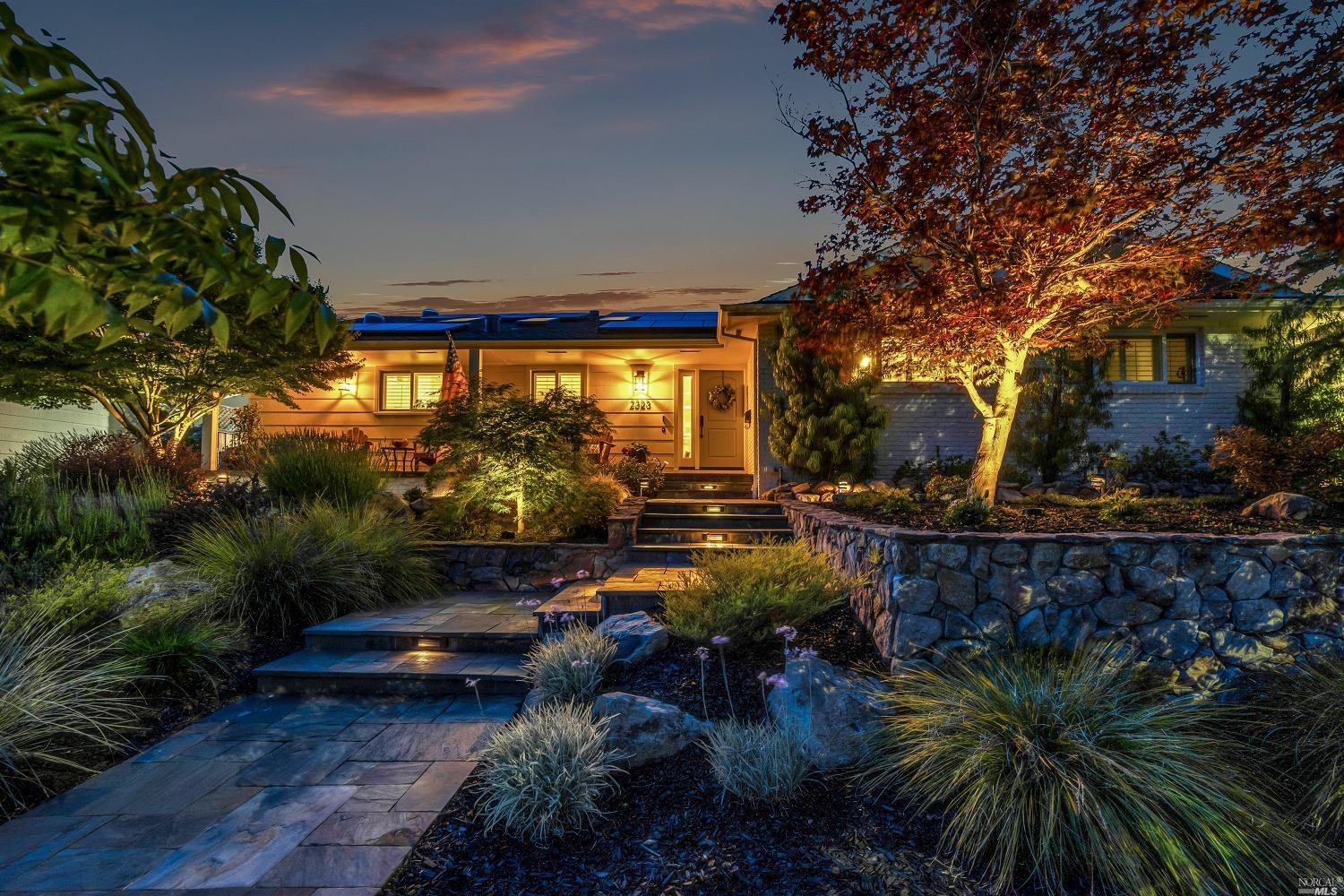 a view of swimming pool with outdoor seating and a garden