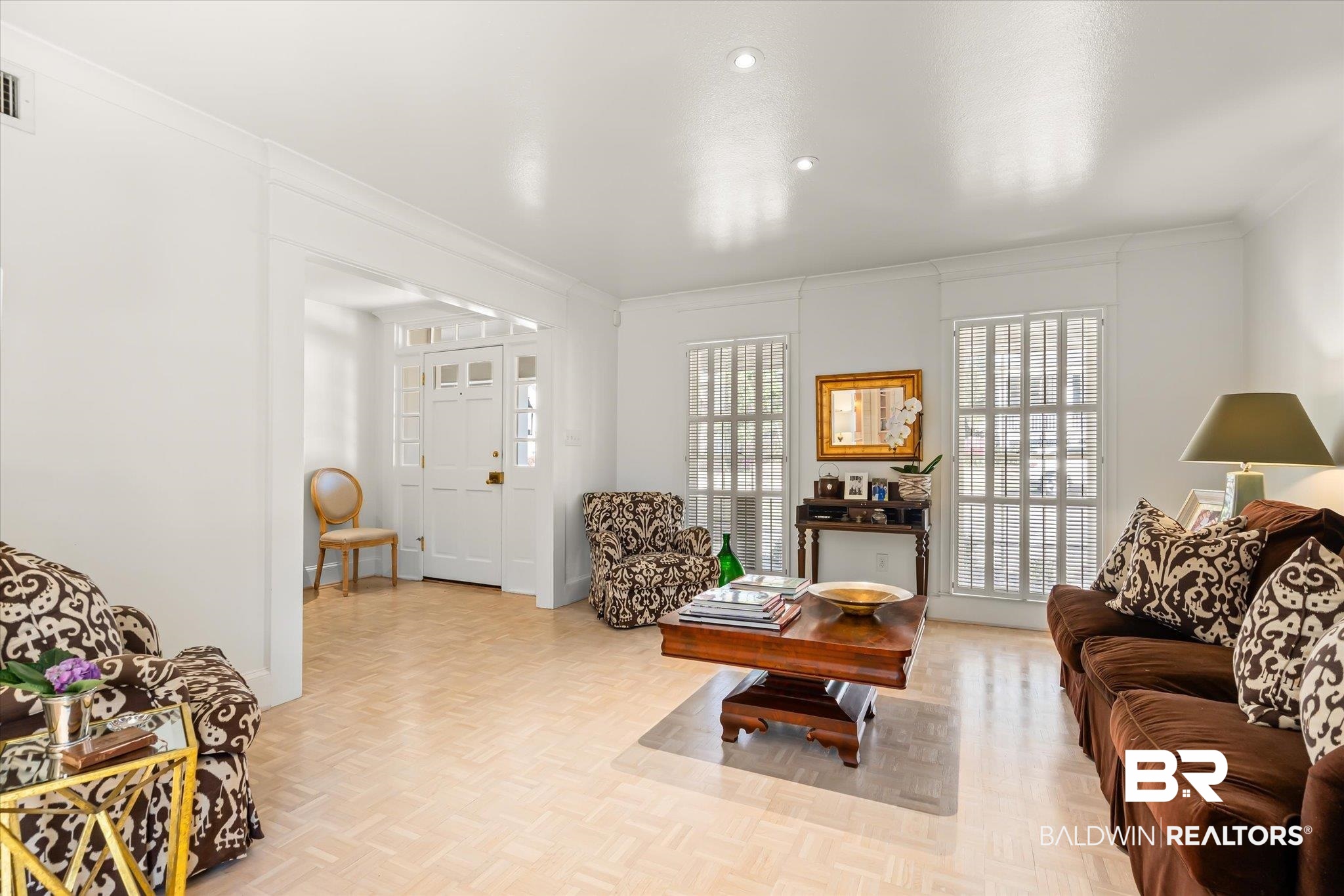 3921 McGregor Court Mobile, AL 36608 - Photo 4 of 41 Living room with visible vents, baseboards, and crown molding