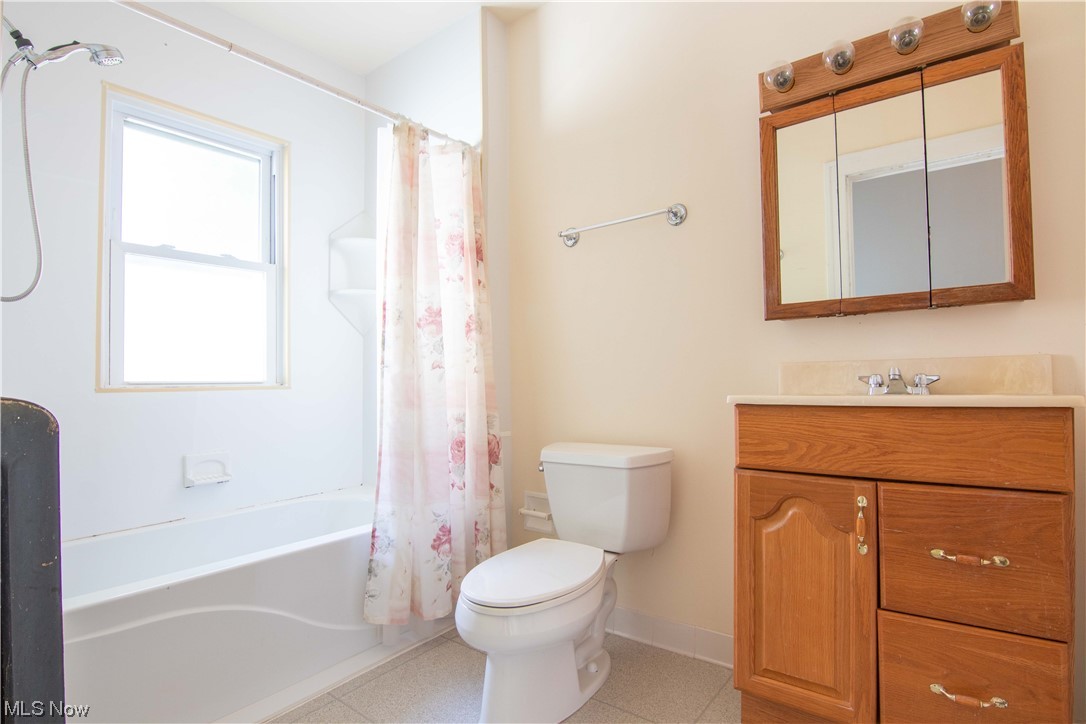 2261 Maplewood Road Cleveland, OH 44118 - Photo 32 of 44 Full bathroom featuring vanity, toilet, tile floors, and shower / bath combo with shower curtain