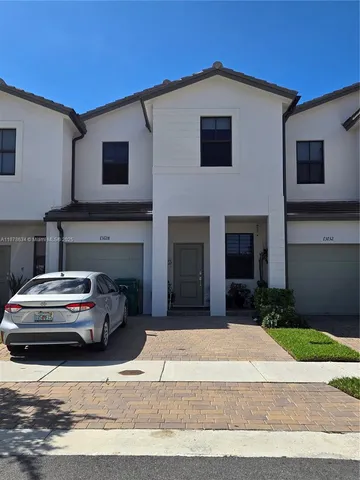 a car parked in front of a house