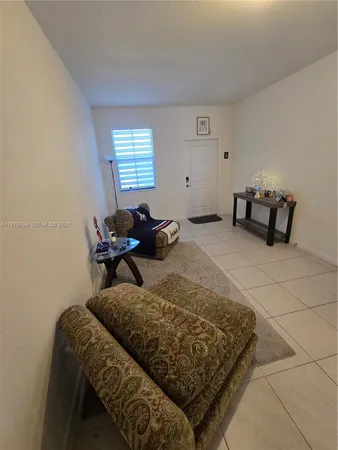 a bed room with a bed and a chair