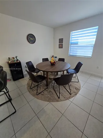 a view of a table and chairs in a room