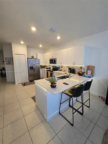a living room with lots of furniture and a table