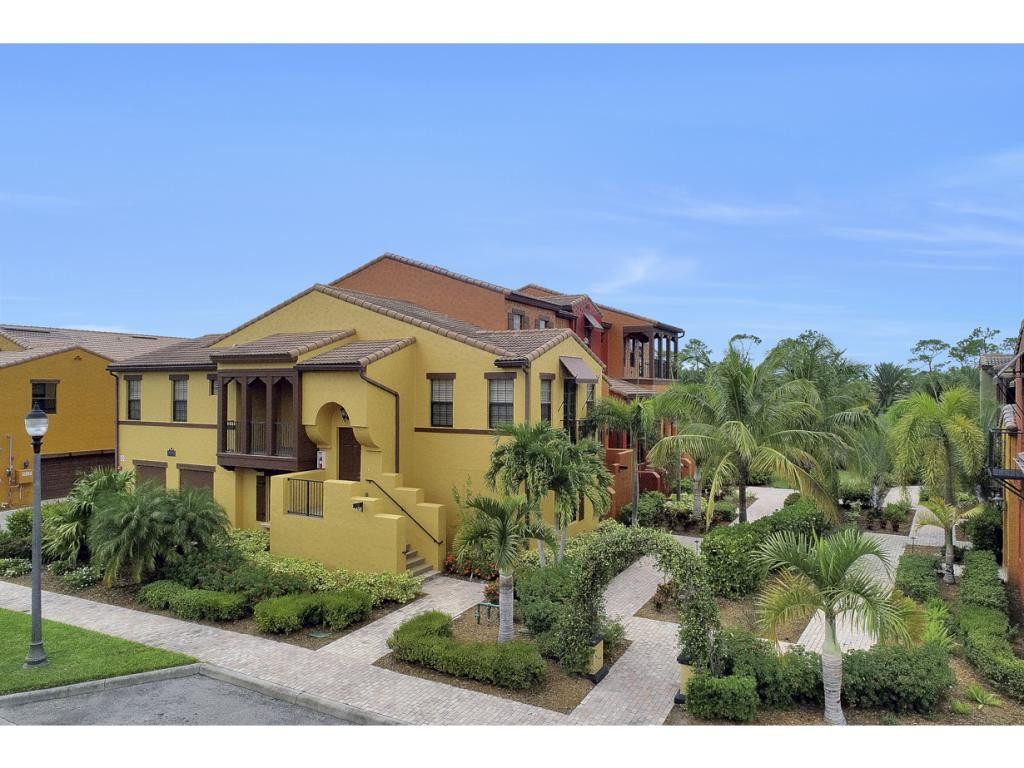 9041 Alturas Street, Unit 3803 Naples, FL 34113 - Photo 18 of 18 a front view of a house with a yard