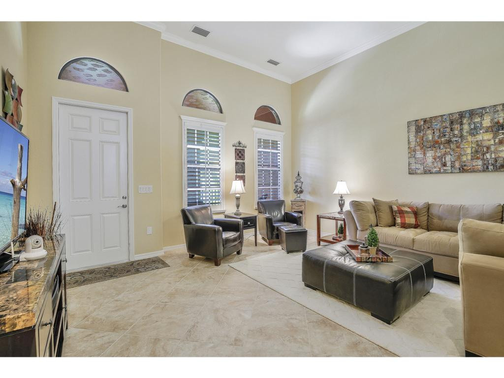 9041 Alturas Street, Unit 3803 Naples, FL 34113 - Photo 6 of 18 a living room with furniture