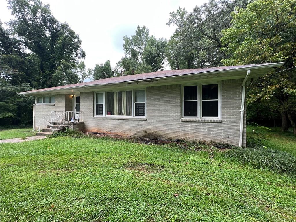 a backyard of a house with seating space