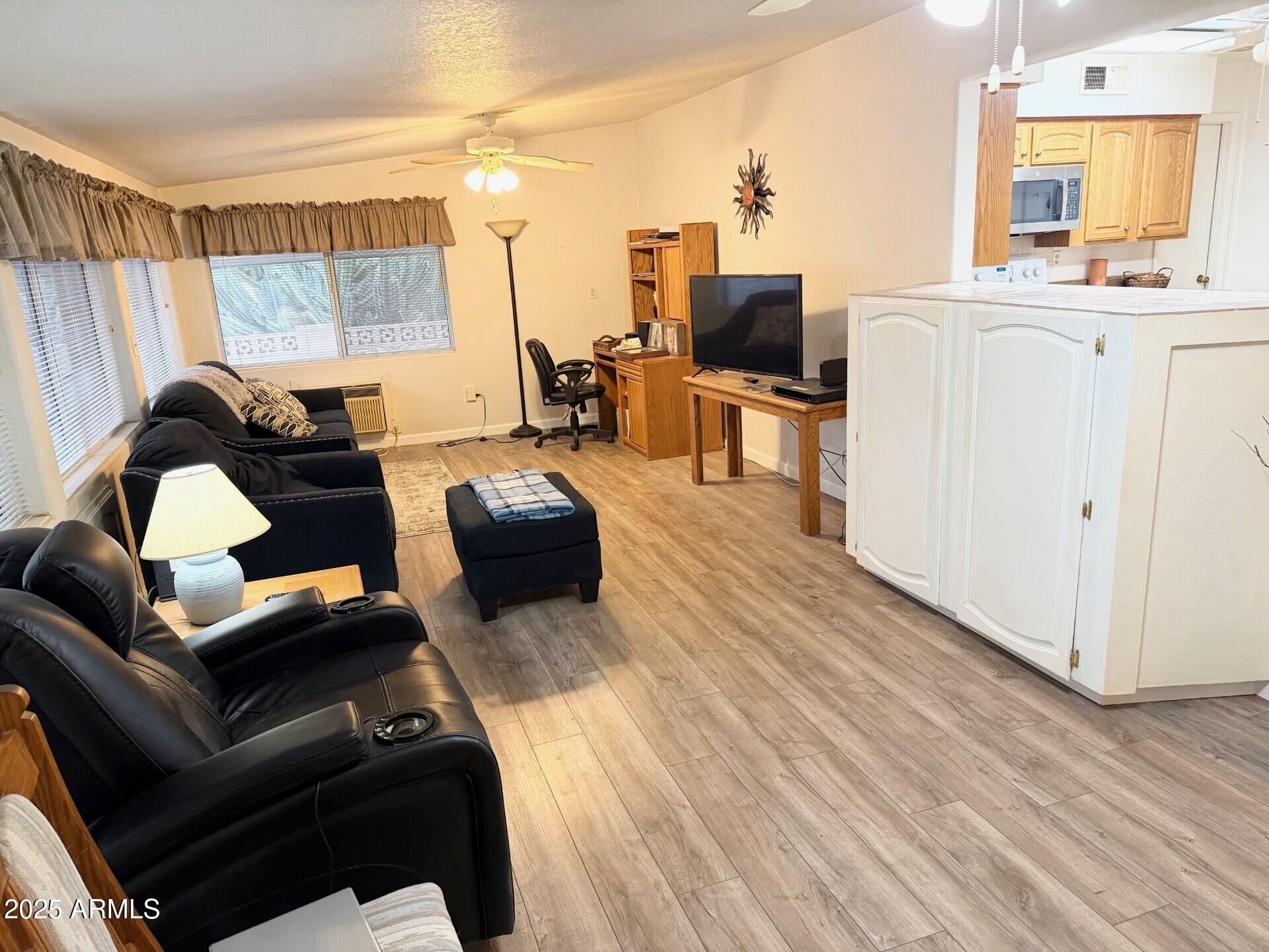 823 South 79th Way Mesa, AZ 85208 - Photo 13 of 46 a living room with furniture and a flat screen tv