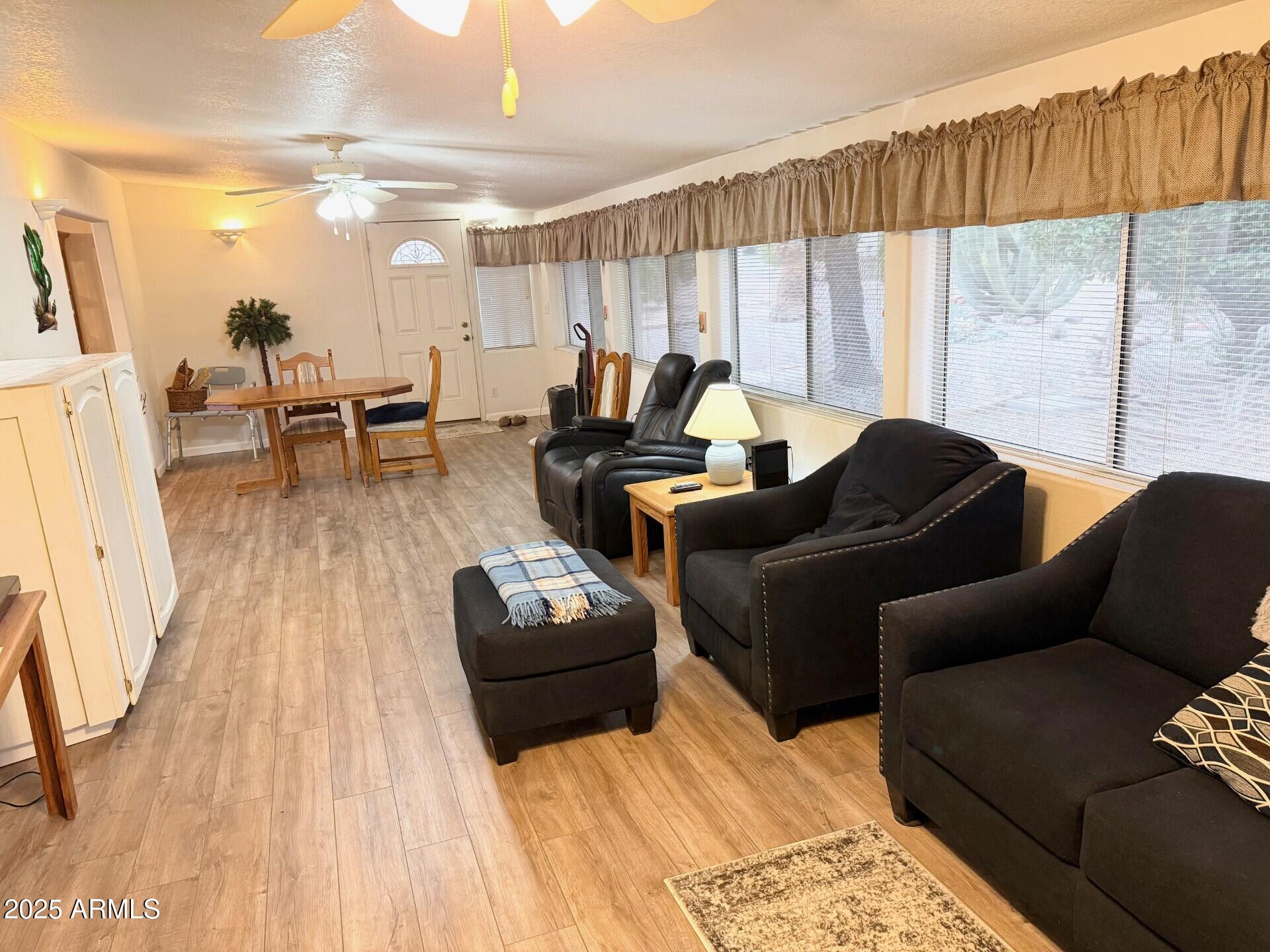 823 South 79th Way Mesa, AZ 85208 - Photo 14 of 46 a living room with furniture and a large window