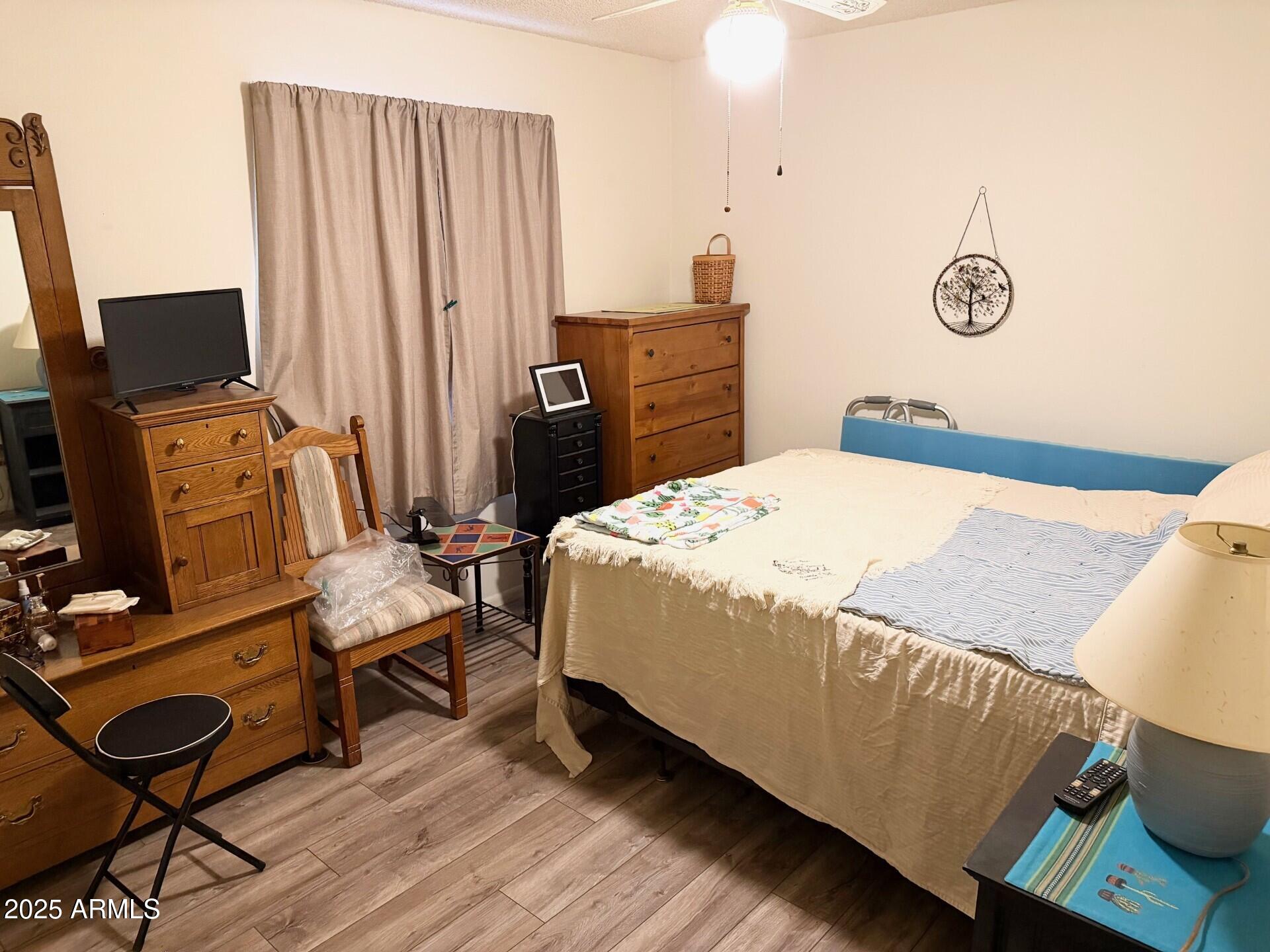 823 South 79th Way Mesa, AZ 85208 - Photo 18 of 46 a bedroom with a bed and a television