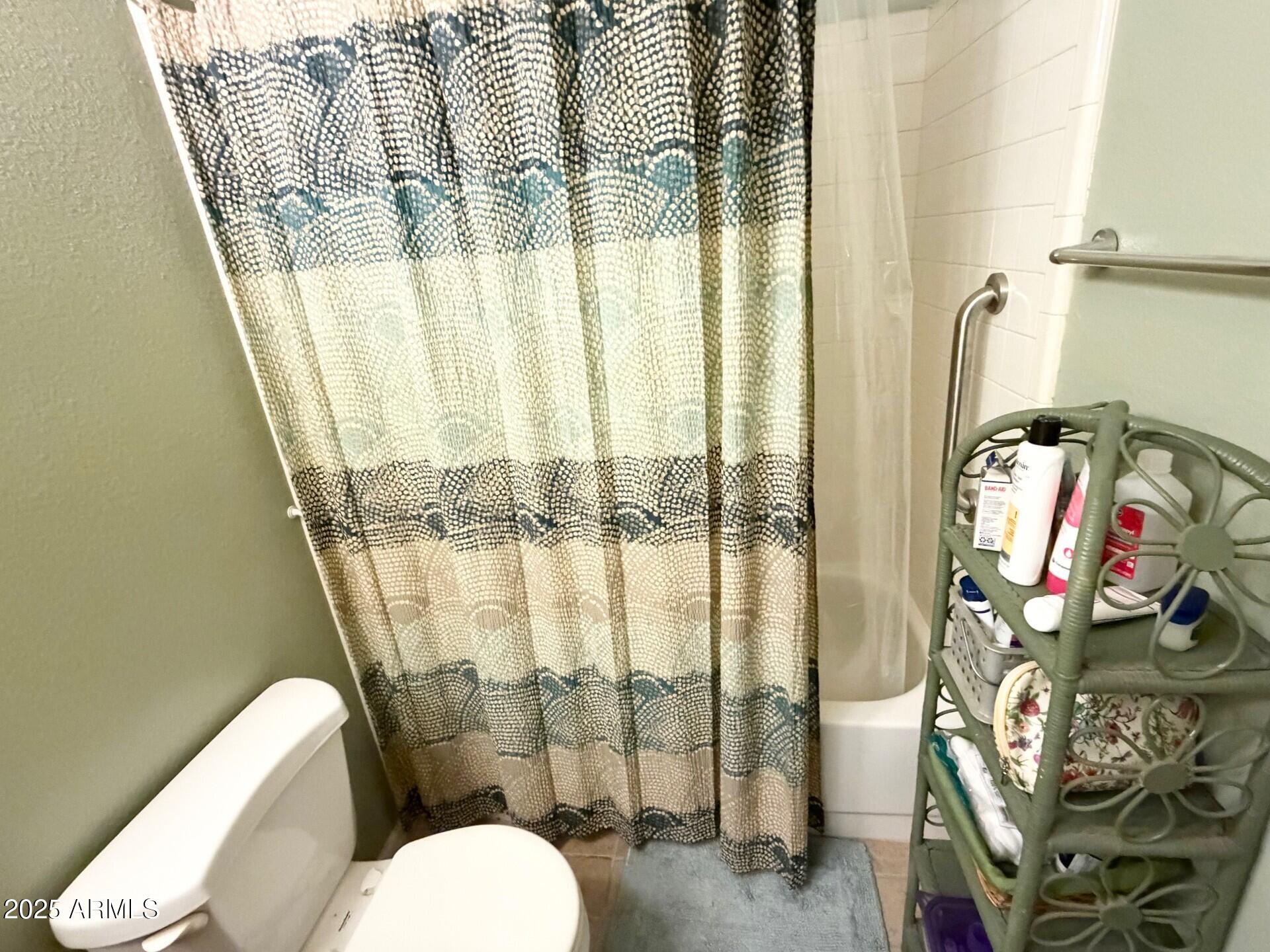 823 South 79th Way Mesa, AZ 85208 - Photo 19 of 46 a bathroom with a toilet and shower