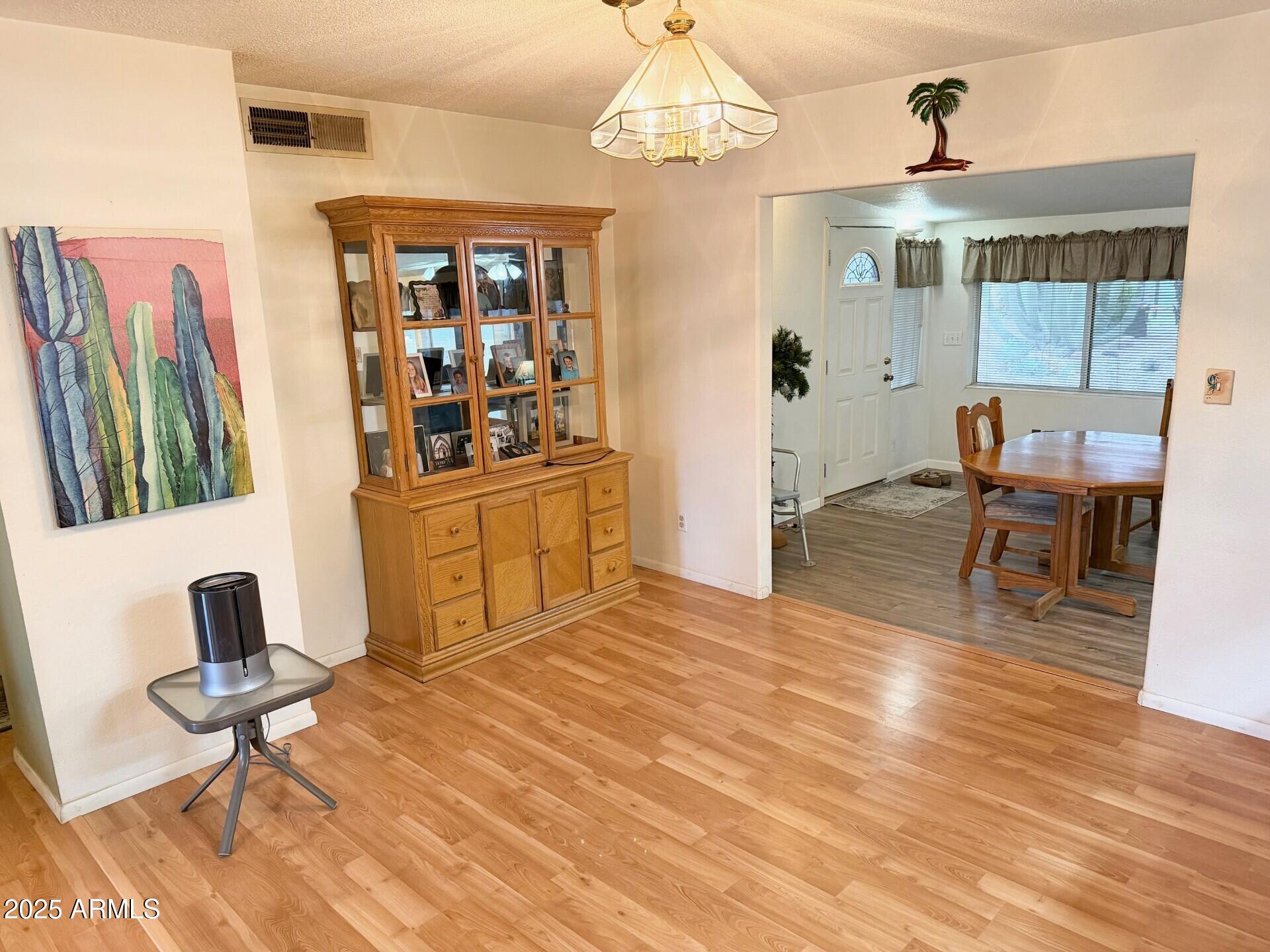 823 South 79th Way Mesa, AZ 85208 - Photo 10 of 46 a view of a livingroom with furniture wooden floor and a window