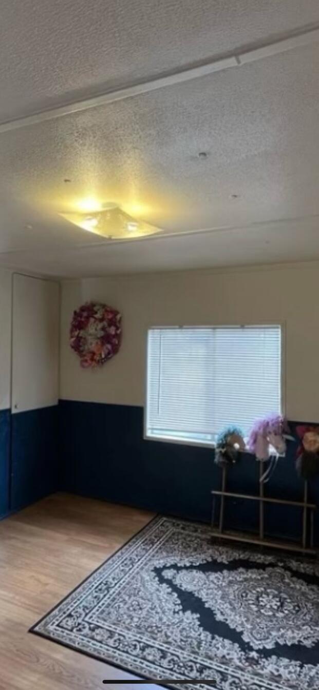 780 Lone Mountain Road O'Brien, OR 97534 - Photo 12 of 33 a room with a rug and a window