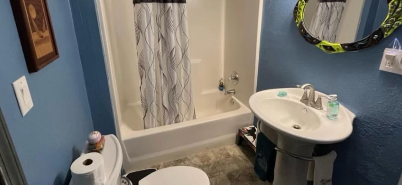 780 Lone Mountain Road O'Brien, OR 97534 - Photo 15 of 33 a bathroom with a sink mirror and toilet
