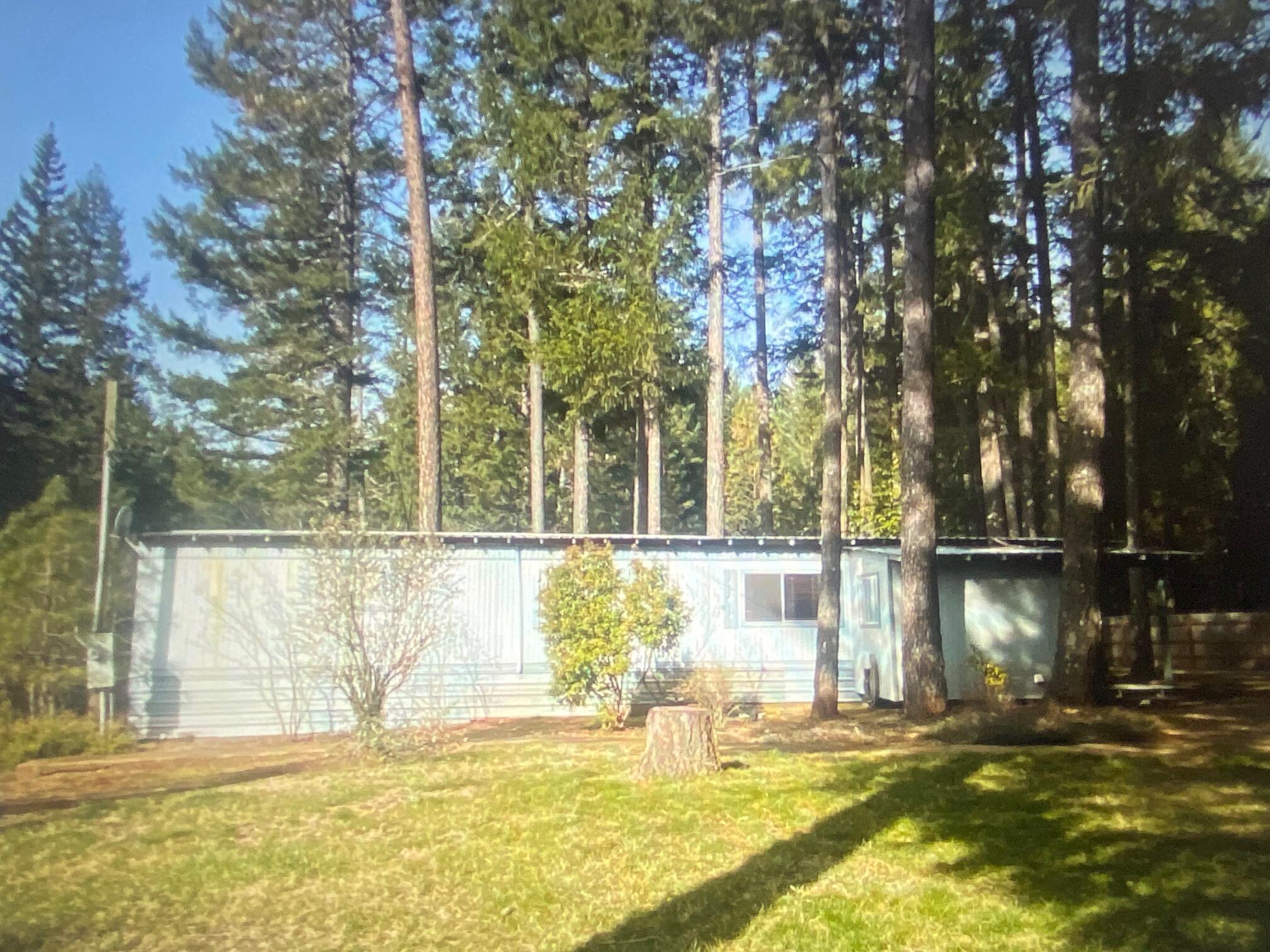 780 Lone Mountain Road O'Brien, OR 97534 - Photo 20 of 33 a view of swimming pool with an outdoor space and seating area