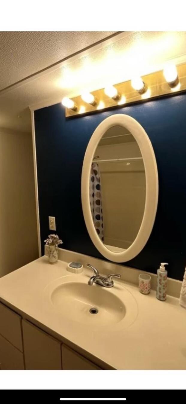 780 Lone Mountain Road O'Brien, OR 97534 - Photo 24 of 33 a bathroom with a sink and mirror