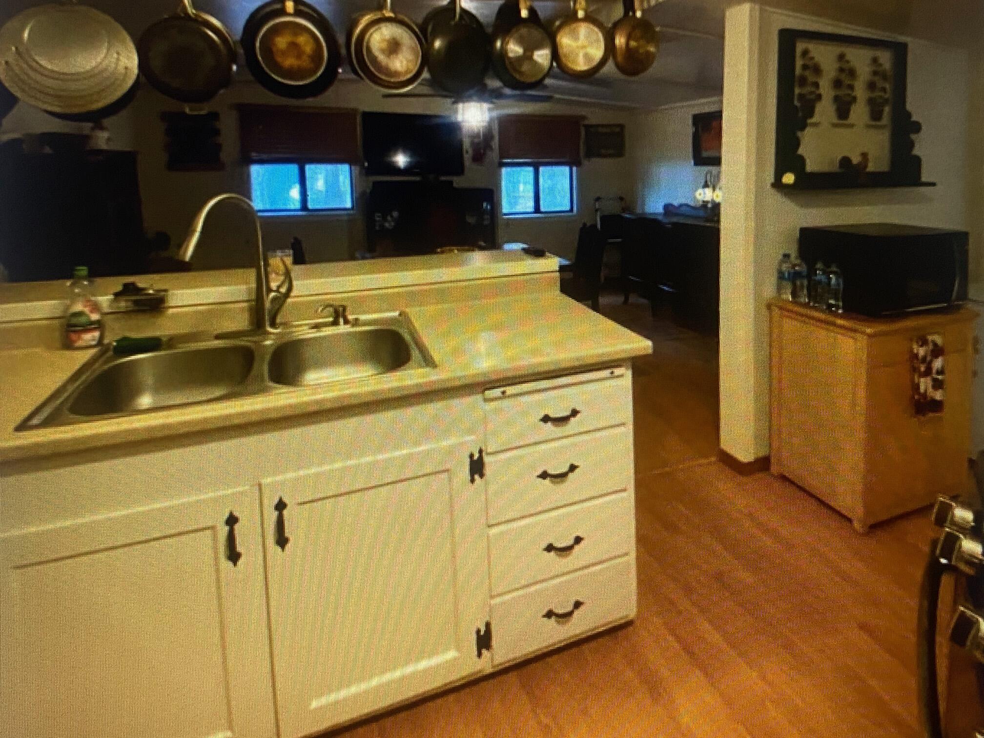780 Lone Mountain Road O'Brien, OR 97534 - Photo 6 of 33 a kitchen with a sink and a stove with cabinets