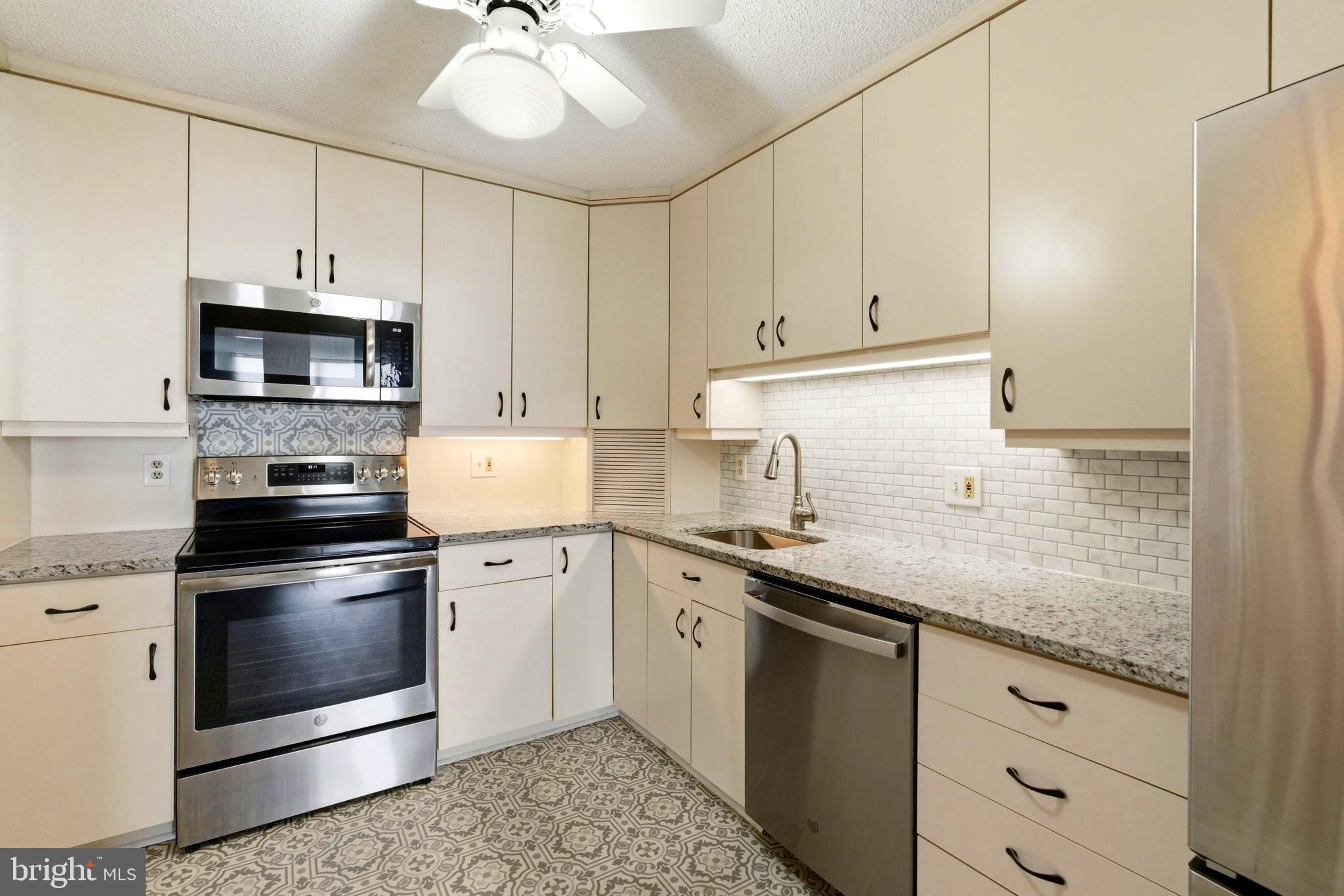 205 East Joppa Road, Unit 1809 Towson, MD 21286 - Photo 12 of 31 Stylish countertops and coordinated backsplash