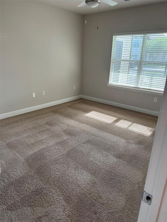 2460 Ann Rou Road, Unit 606 Tavares, FL 32778 - Photo 13 of 18 an empty room with a window