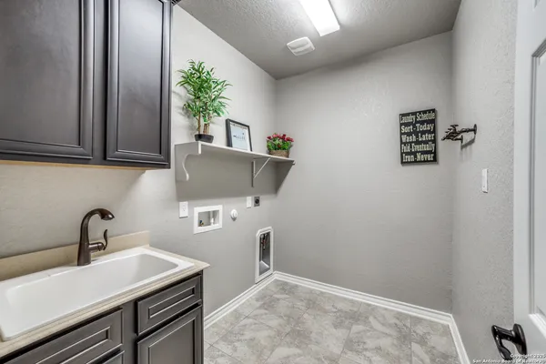 a kitchen with a sink and cabinets