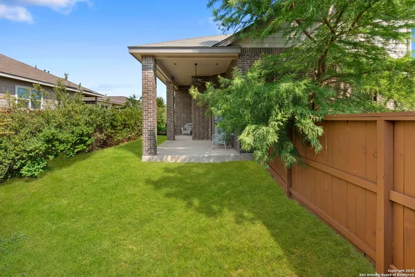 a view of a back yard of the house