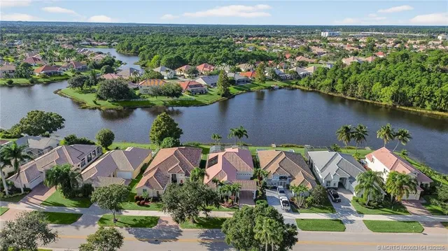 an aerial view of a house with a lake view