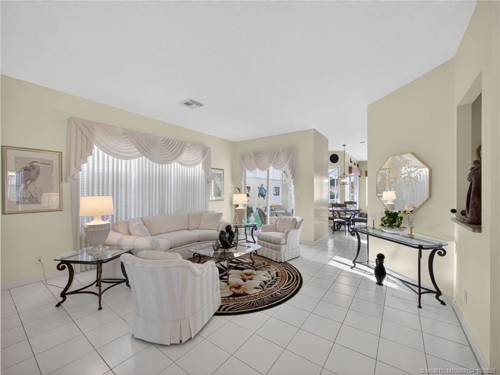 618 Southwest Lake Charles Circle Port St. Lucie, FL 34986 - Photo 13 of 29 a living room with furniture
