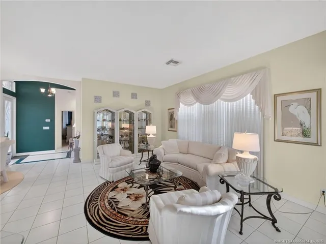 a living room with furniture and a table
