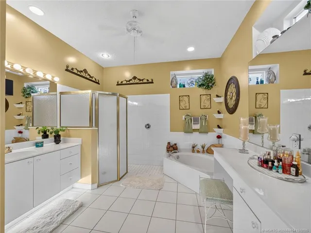 a large room with lots of white furniture