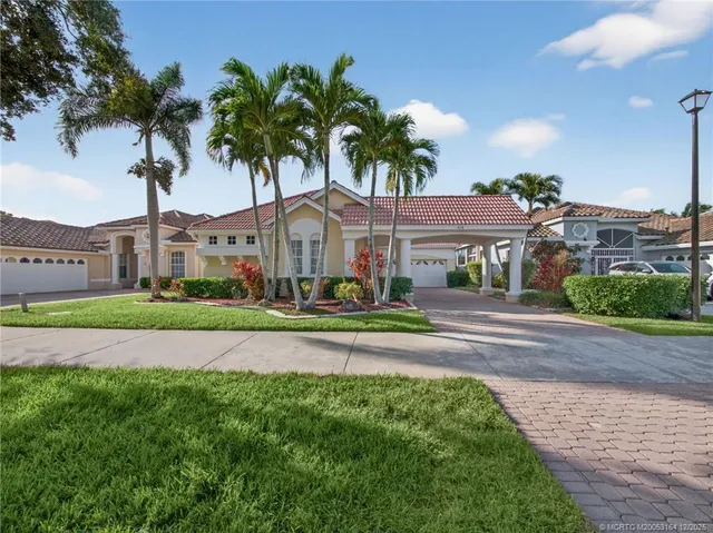 a front view of multiple houses with yard