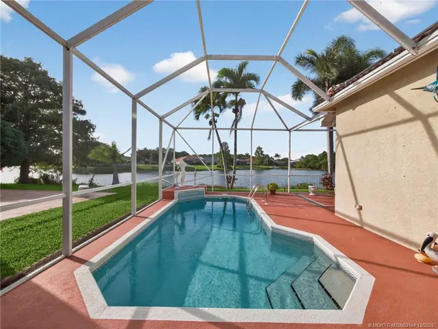 a view of a swimming pool with a porch