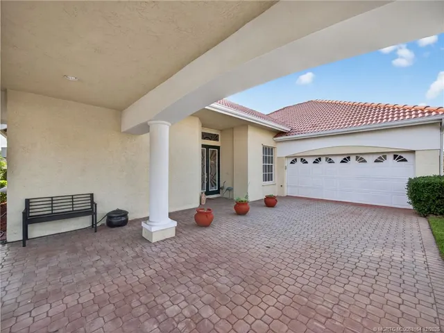 a view of a room with gym equipment and a large window