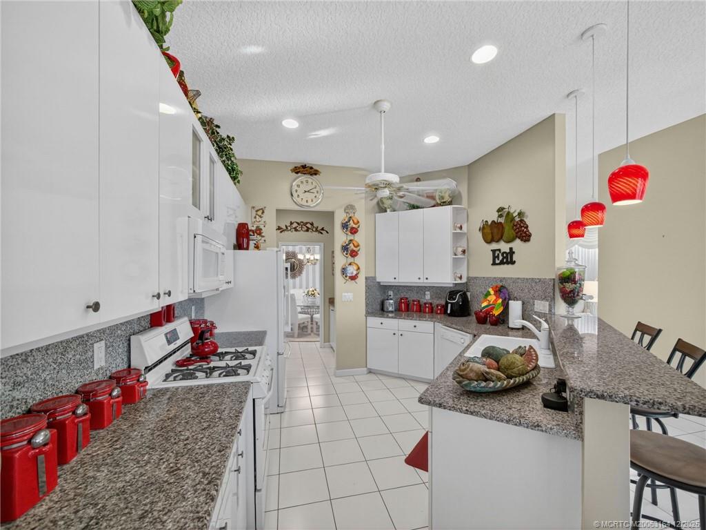 618 Southwest Lake Charles Circle Port St. Lucie, FL 34986 - Photo 7 of 29 a room with storage and utility