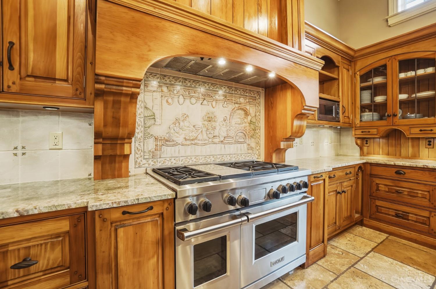 1054 Observatory Point Maineville, OH 45039 - Photo 9 of 82 Look at the commercial size Wolf gas range with double oven and 6 burners.