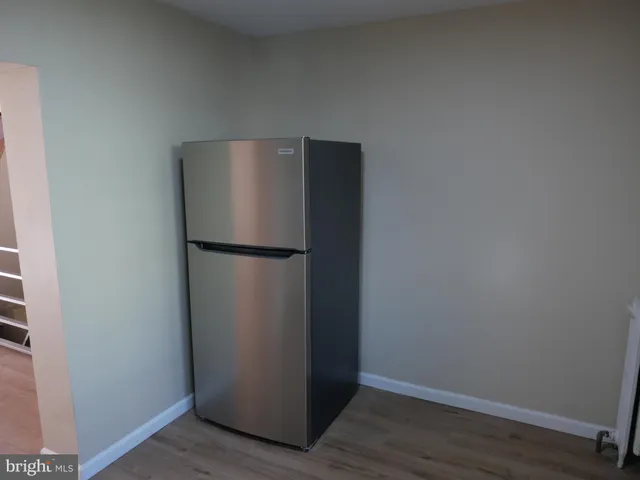 a view of a refrigerator in a kitchen